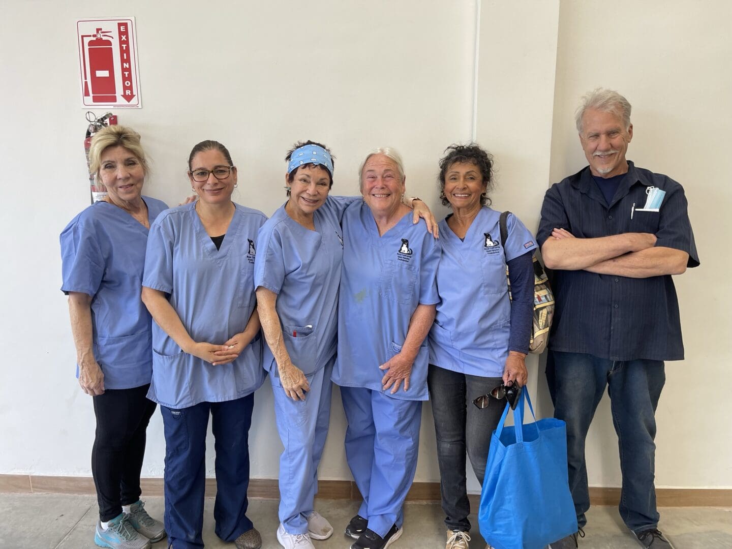 A group of nurses standing next to each other.